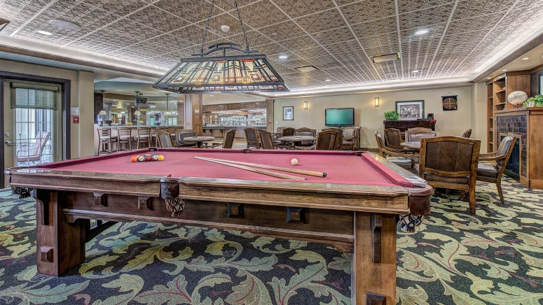 dining room with pool table in the middle
