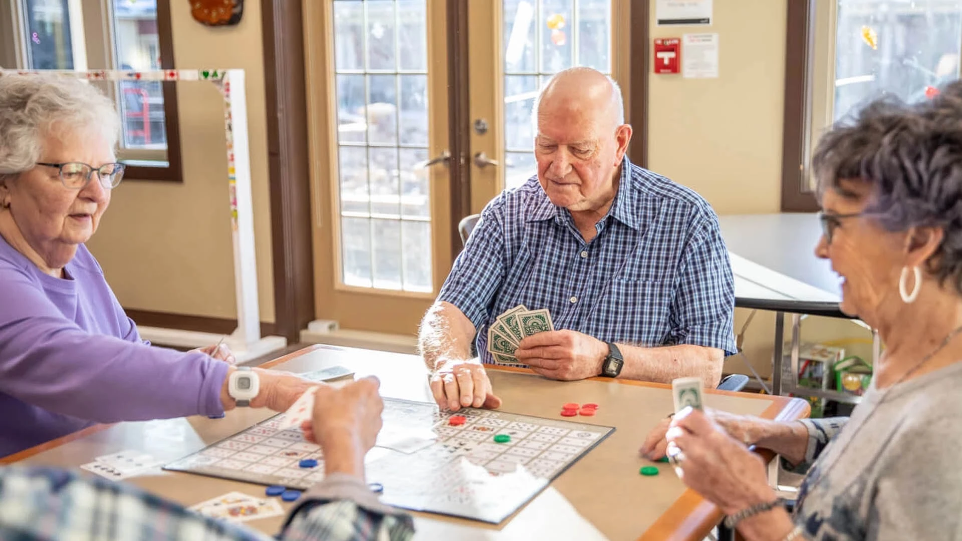 Group of seniors playing a card game.